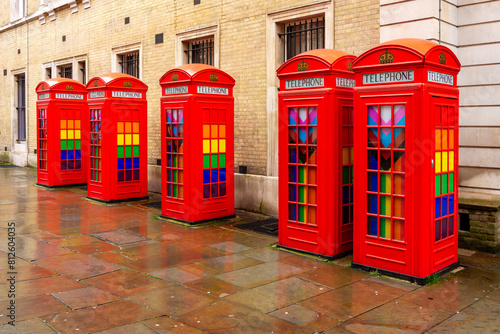 Five red phone boxes on Covent Garden, London, UK photo