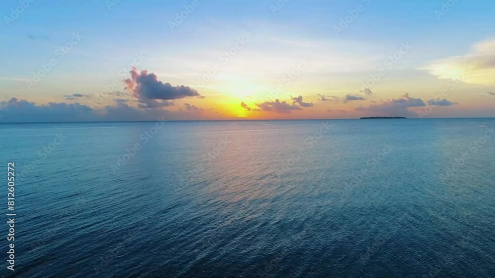 Aerial view of beautiful dramatic golden sunset over the sea and reflection at sunset time in the summer Aerial view of beautiful dramatic golden sunset over the sea and reflection at sunset time in the summer