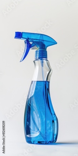 Windex Spray Bottle with Blue Window Cleaner on White Background. Isolated Plastic Bottle photo