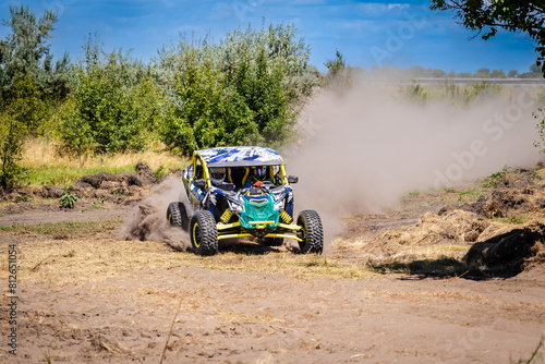 UTV kicking up sand on a dune. Extreme. 4x4. © Anton Tolmachov