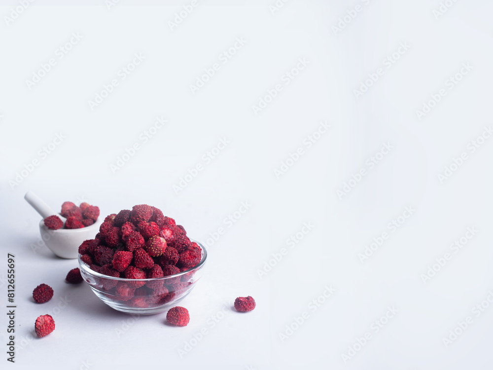 Dried dehydrated wild strawberry on white background copy space healthy snack ingredient cooking concept Dried dehydrated wild strawberry on white background copy space healthy snack ingredient cooking concept