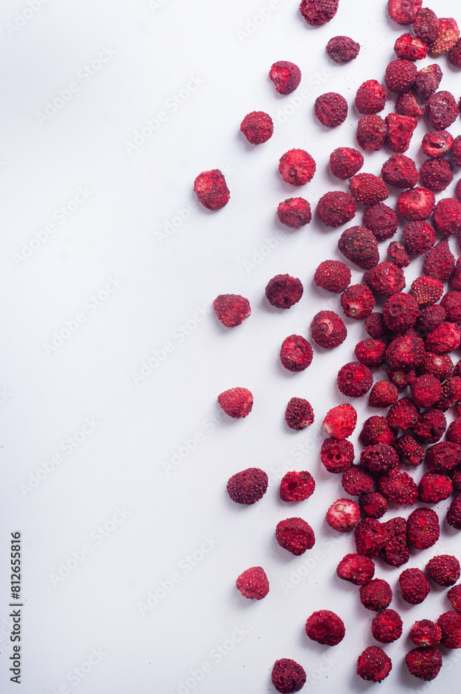 Dried dehydrated wild strawberry on white background copy space healthy snack ingredient cooking concept Dried dehydrated wild strawberry on white background copy space healthy snack ingredient cooking concept