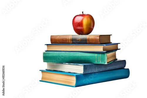 A stack of books with an apple on top. The apple is red and shiny. The books are of different sizes and colors
