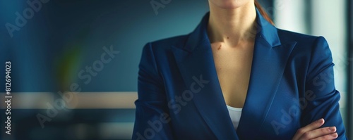 Closeup of a female business executive s torso in a charcoal grey suit, perfect for international business profiles and global strategy discussions photo