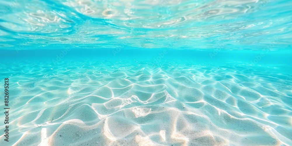 Underwater view of clear blue water, with light ripples and a white background. ocean underwater, beach underwater with white sand