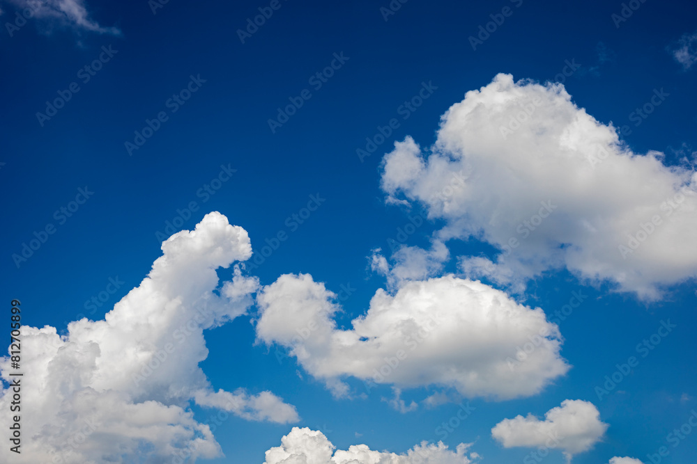 Blue summer sky with fluffy clouds Blue summer sky with fluffy clouds