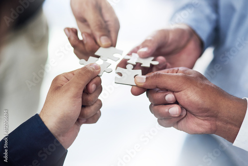 Teamwork  business and hands of people with puzzle for unity or collaboration with joint effort for project. Group  diversity and pieces together for planning or partnership  union and engagement.