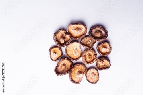 Dried shiitake mushrooms on white background flat lay copy space japanese cuisine
