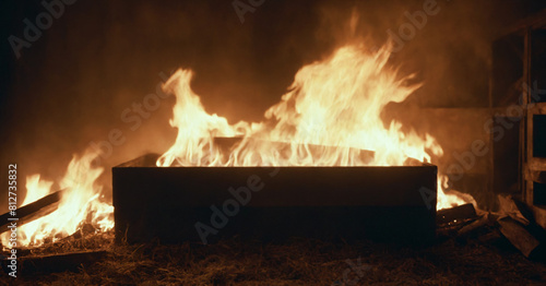 Deliberate arson - blazing box ignites a room in flames.