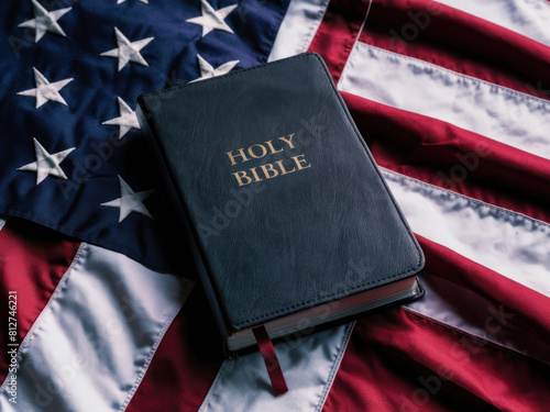 Faith and Nation: Exploring the Intersection of Christianity and Patriotism. Christianity and Patriotism concept. The holy Bible laying on a red white and blue american flag. © ana