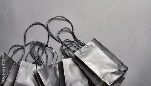 black shopping bags on black background black friday sale flat lay