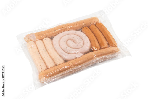 Sausages in vacuum plastic packaging isolated on white background. Vacuum transparent packaging with fresh sausages. A pack of sausages in a vacuum foil isolated.