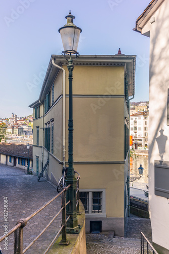 A hidden narrow alley in the center of Zurich old town ("Altstadt") in a spring afternoon
