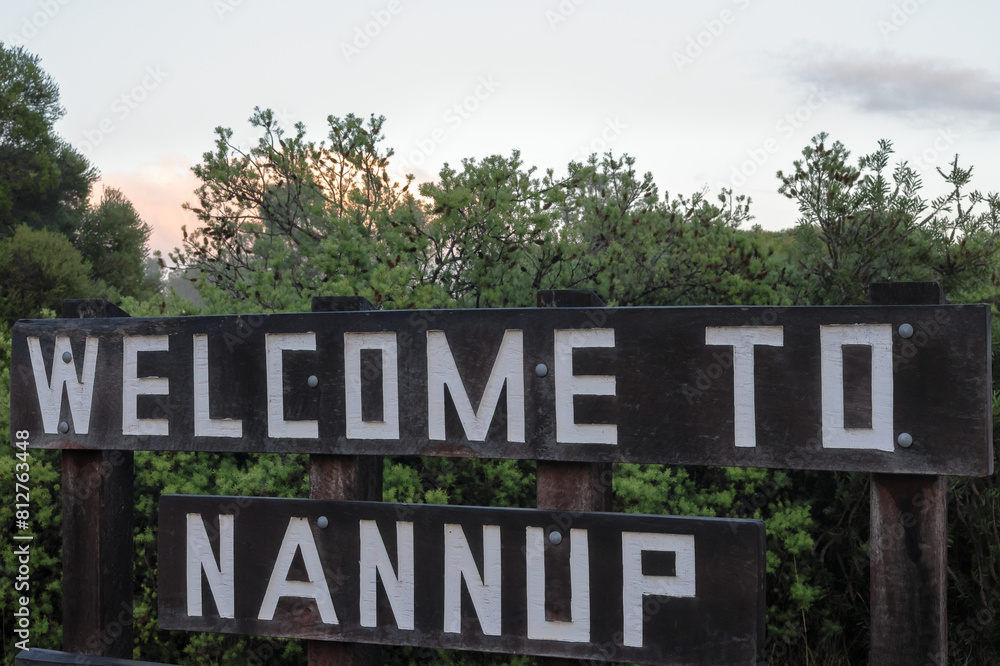 Fototapeta premium Welcome to Nannup wooden sign post. Tourism and event hotspot, South West, Western Australia. Host 2026 UCI Gravel World Championships.