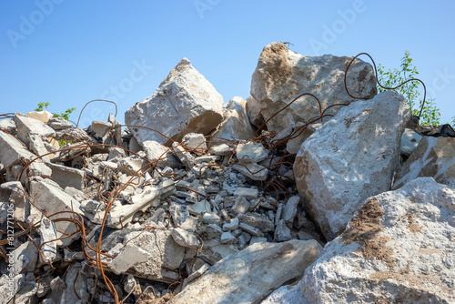Pile concrete rubble. Remains of the destroyed building
