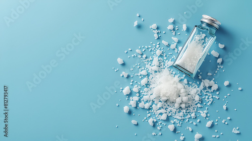 Spilled salt and saltshaker on blue background , generative ai photo