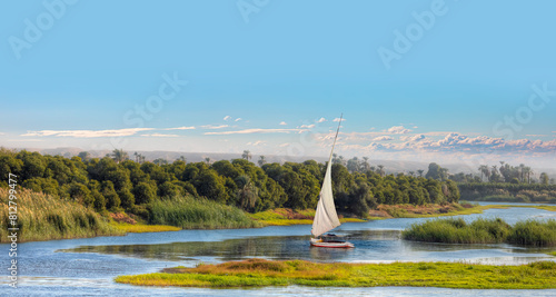 Fotografija White sailing Felucca sailboats on River Nile, Aswan, Egypt