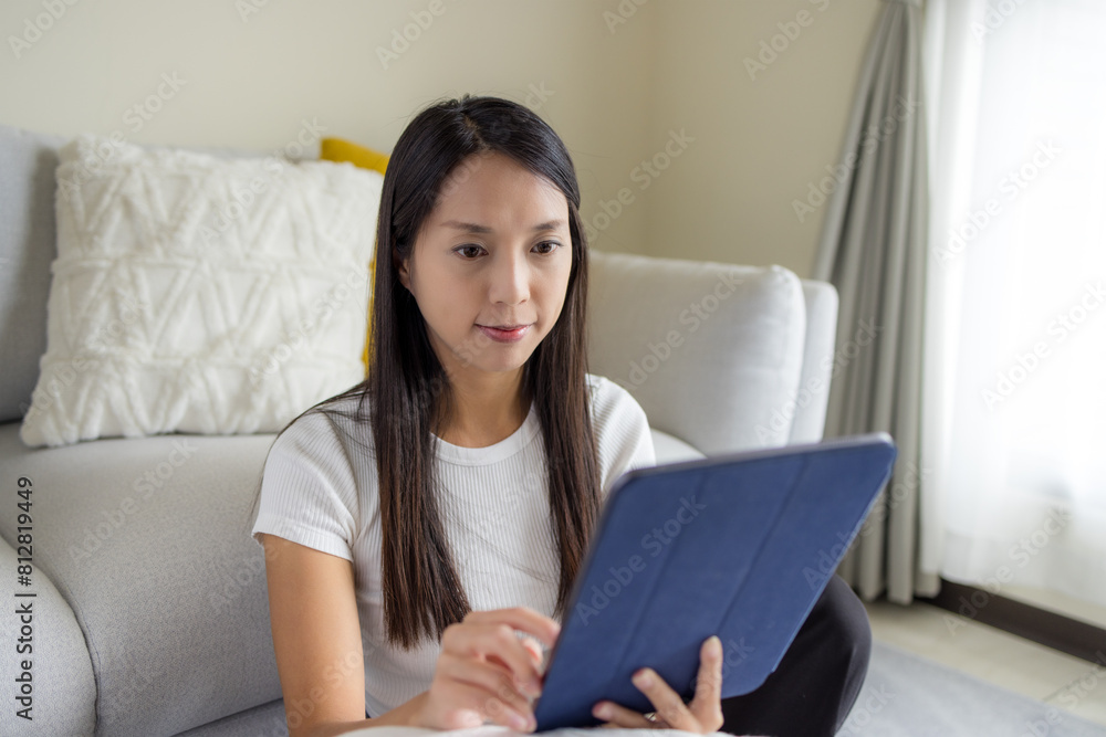 Woman look at the digital tablet at home Woman look at the digital tablet at home