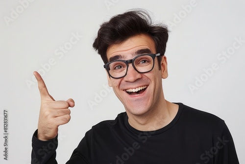 A cheerful man pointing to his rejuvenated hair after treatment with a stark white background to emphasize the change