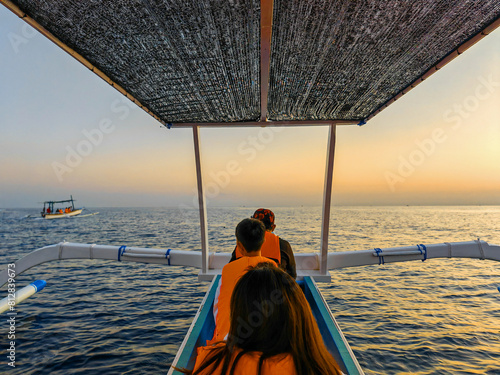 Dolphins watching adventure tour on Lovina Beach Bali Indonesia photo