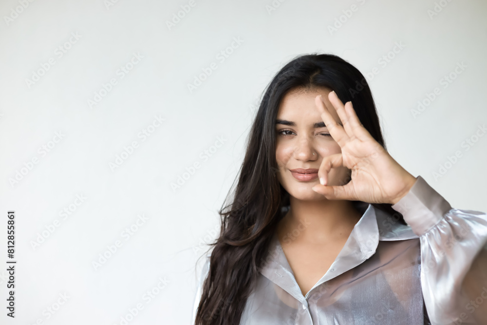 South Asian Woman giving approving, yes, alright, ok, positive, OK for all correct gesture South Asian Woman giving approving, yes, alright, ok, positive, OK for all correct gesture