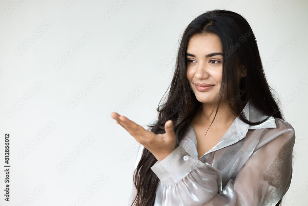 South Asian woman pointing finger up to blank space South Asian woman pointing finger up to blank space