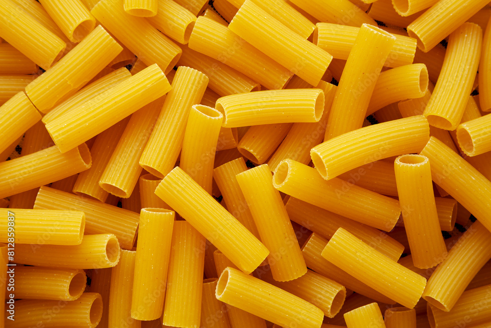 Organic Dry Rigatoni Pasta, top view. Flat lay, overhead, from above. Organic Dry Rigatoni Pasta, top view. Flat lay, overhead, from above.