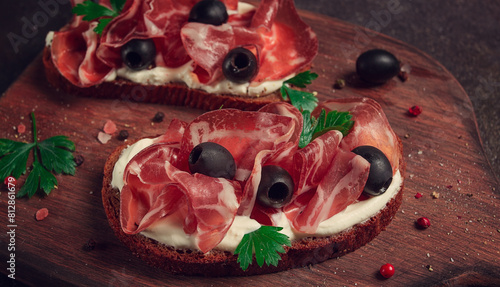sandwich with cream cheese, prosciutto with olives , breakfast,