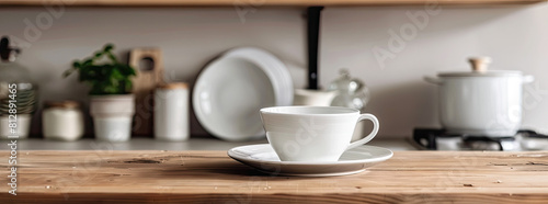 A modern ceramic cup  saucer  bowl  and plate elegantly displayed on a wooden kitchen counter  exemplifying contemporary home decor 