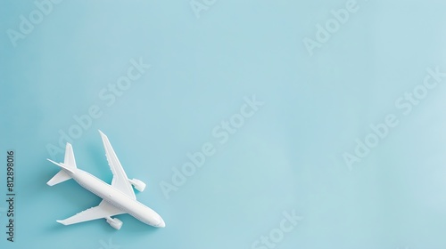 Airplane model White plane on pastel blue background Travel vacation concept Summer background Flat lay top view copy space : Generative AI