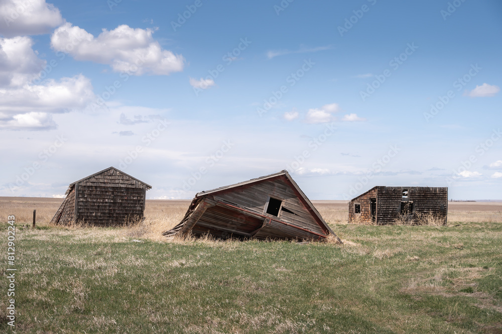 Fototapeta premium Abandoned farm buildings in rural Alberta.