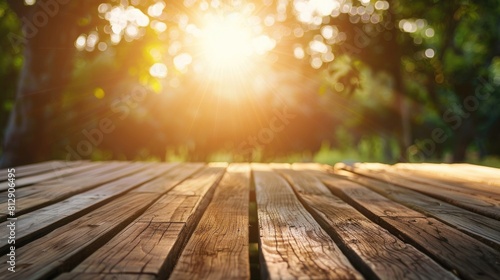 Wooden floor in the park with sun light and bokeh background