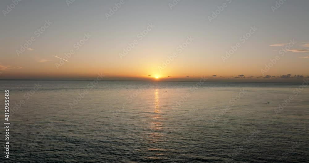 The sunset paints the sky over the tranquil lake with a warm afterglow The sunset paints the sky over the tranquil lake with a warm afterglow