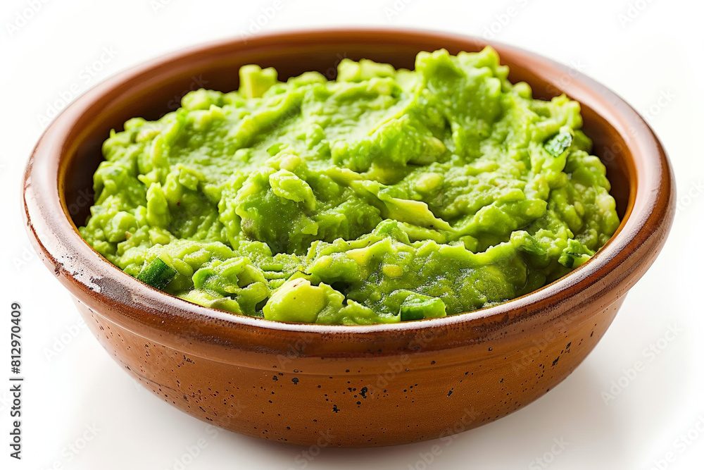 Bowl of fresh guacamole, vibrant green with visible chunks of avocado, isolated on white Bowl of fresh guacamole, vibrant green with visible chunks of avocado, isolated on white