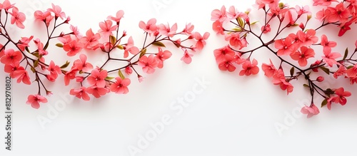 Top view of white fabric background with a pattern of pink coral vine flowers perfect for a copy space image