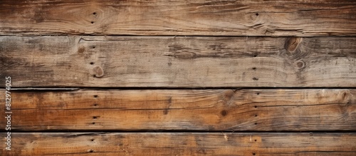 An aged wooden wall displaying a close up of vintage planks The background is composed of weathered panels showcasing its natural texture Copy space image