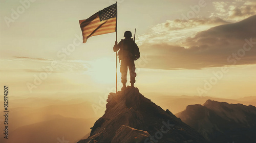 Soldier plants American flag on mountaintop at sunset in a dramatic patriotic composition. photo