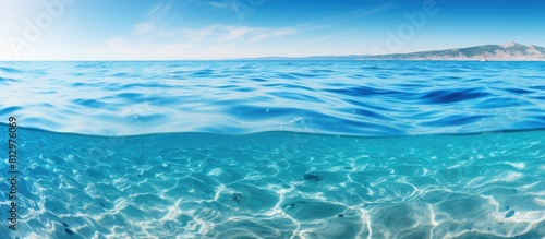 A close up image showcasing the crystal clear surface of the sea water providing a captivating background for your copy space image