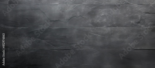 Panel kuchenny z motywem Top view of a textured background in dark grey or black slate providing ample copy space for an image