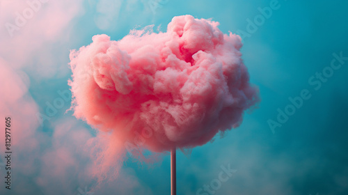 Pink cloud shape cotton cundy. 
Blue pastel color background.