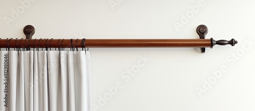 A traditional window latch hook hangs on a white background providing a copy space image photo