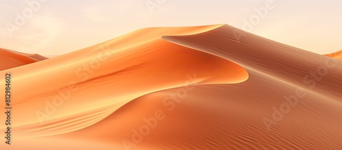 A background of orange sand with plenty of empty space for adding an image. Copyspace image