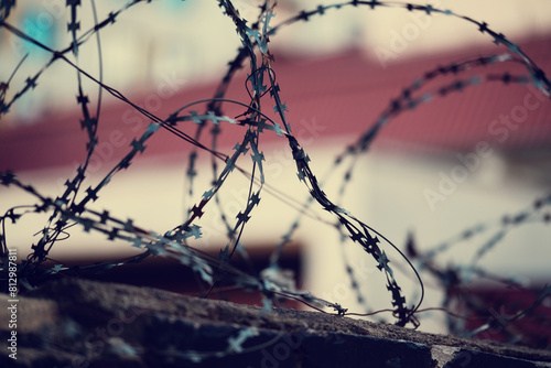 Barbed wire. Barbed wire on a fence as a background photo