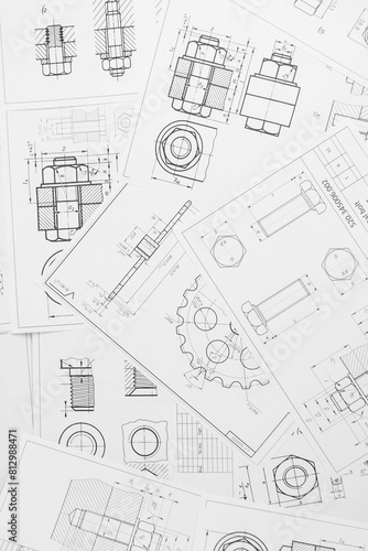 paper engineering drawings of industrial parts and mechanisms	
