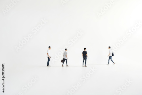 Silhouetted Figures Walking Across a White Background