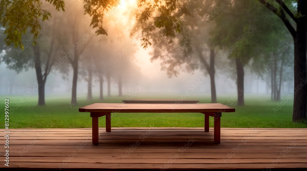 Fototapeta premium Wooden table on the background of the evening foggy park