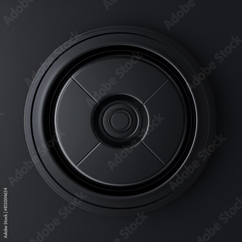 a close up of a black speaker with a circular design
