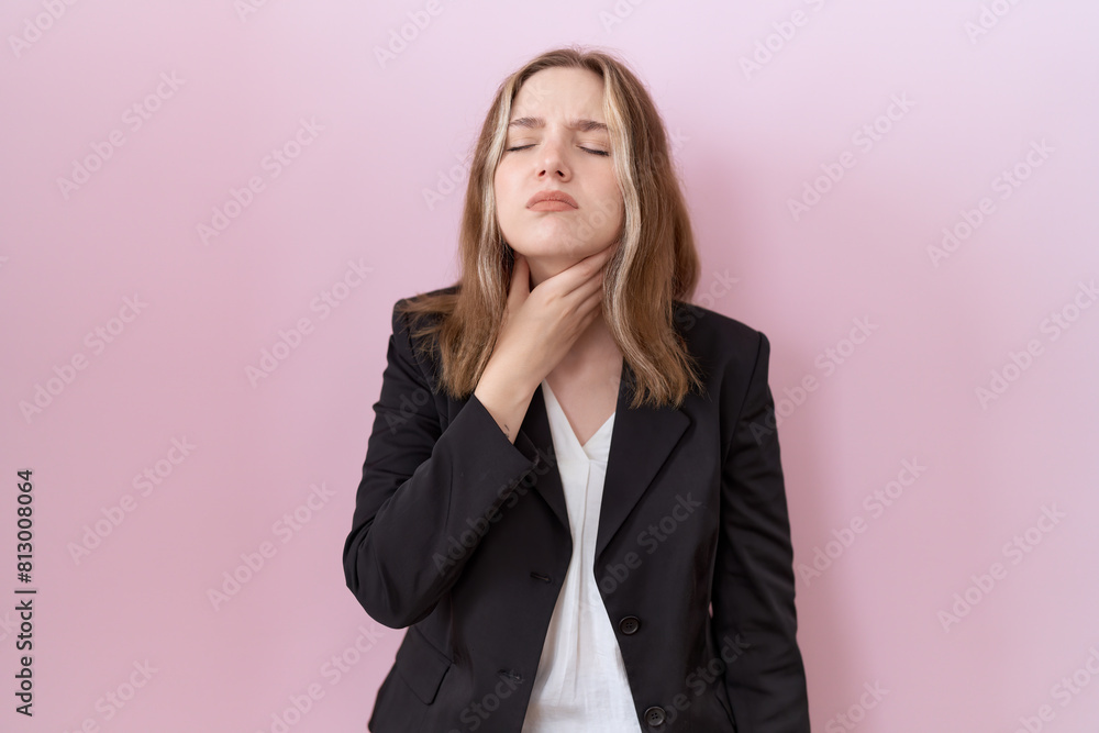 Young caucasian business woman wearing black jacket touching painful neck, sore throat for flu, clod and infection Young caucasian business woman wearing black jacket touching painful neck, sore throat for flu, clod and infection
