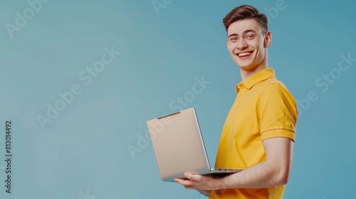Smiling Young Man with Laptop © Roger Bron
