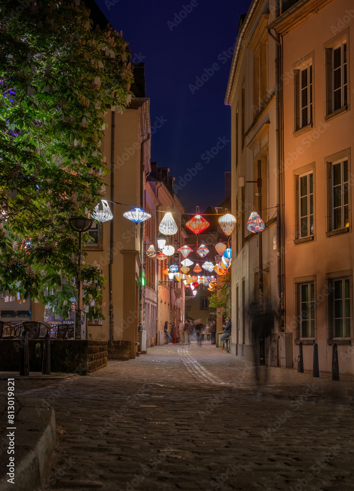 Fototapeta premium Street of the night city of Luxembourg with glowing laterns